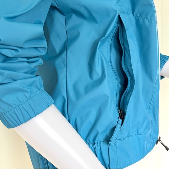 Columbia teal blue rain jacket wind breaker with hidden roll up hood - Picture 4 of 16